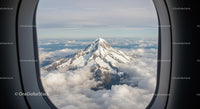 Snow-Capped Mountain View from Airplane Window