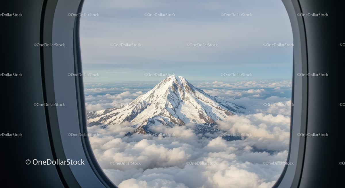 Stunning Snowy Mountain Peak Viewed From Airplane Window