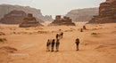 Caravan of Camels in Majestic Desert Landscape