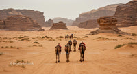Camel Caravan Journey Through Scenic Desert Landscape