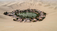 Stunning Desert Oasis Surrounded by Endless Sand Dunes