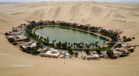 Aerial View of Huacachina Oasis Amidst Sand Dunes