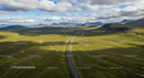 Scenic Winding Road Through Rolling Green Highlands