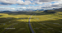 Scenic Winding Road Through Rolling Green Highlands