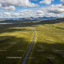 Aerial View of Scenic Road Through Icelandic Wilderness