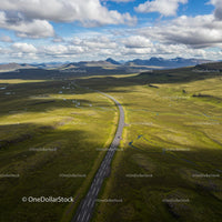 Aerial View of Scenic Road Through Icelandic Wilderness