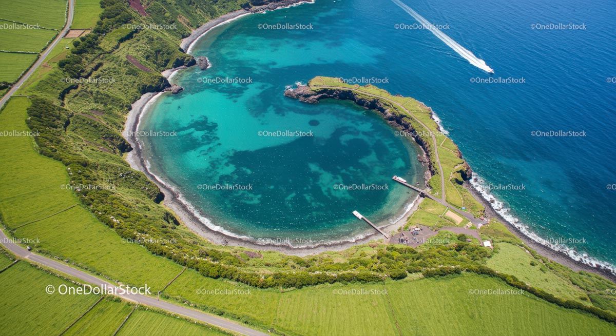 Scenic Aerial View of Turquoise Bay and Lush Green Coastline
