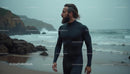Surfer Strolling on a Foggy Ocean Beach