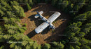 Abandoned Plane in Forest Clearing from Above