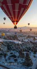 Hot Air Balloons Over Snowy Cappadocia at Sunrise