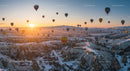 Hot Air Balloons at Sunrise Over Snowy Cappadocia