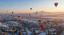 Hot Air Balloons Over Snowy Cappadocia at Sunrise