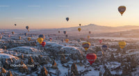 Hot Air Balloons Over Snowy Cappadocia at Sunrise
