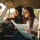 Two Friends Enjoying a Road Trip Adventure in a Van