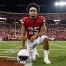 Focused Football Player in Red Jersey on Game Day