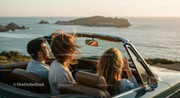 Two Women Driving Vintage Convertible by Ocean