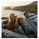 Friends Enjoying a Scenic Convertible Drive by the Coast