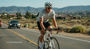 Cyclist on Scenic Road During Sunny Day Workout