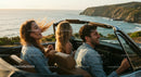 Friends on a Coastal Road Trip in Convertible Car