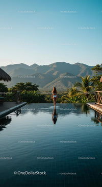 Woman Relaxing in Infinity Pool with Mountain View