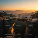 Hiker on Scenic Rock Arch at Sunset