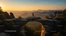 Hiker on Natural Arch at Sunset with Mountain Views