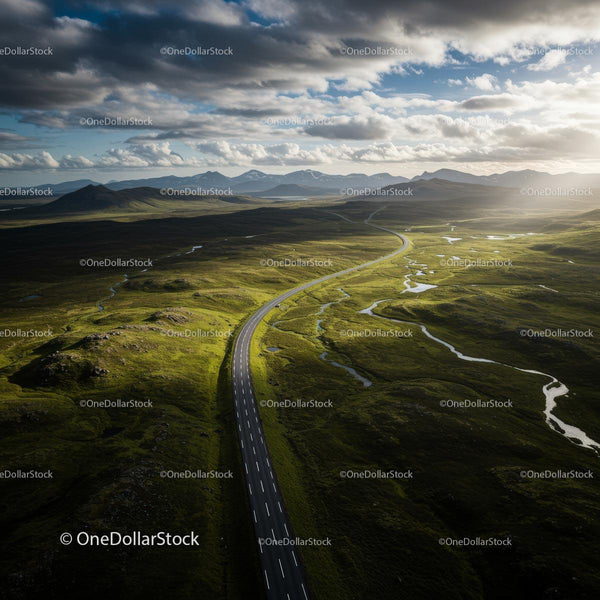 Winding Road Through Scenic Green Hills and Mountains