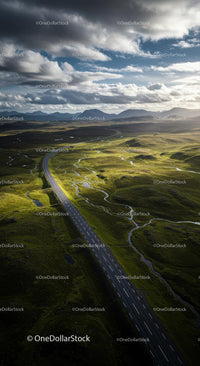 Scenic Highway Surrounded by Rolling Green Hills