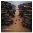 Aerial View of Cars Navigating a Remote Desert Canyon