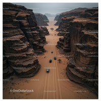 Aerial View of Cars Navigating a Remote Desert Canyon