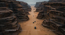 Aerial View of Cars Driving Through Majestic Desert Canyon