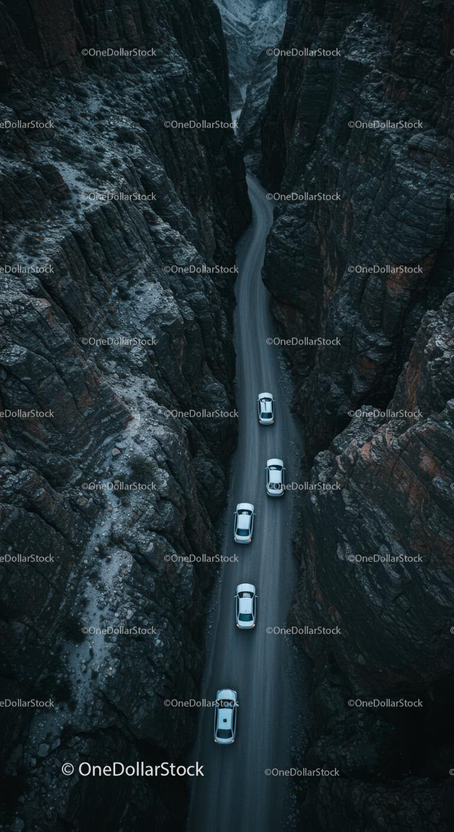 Cars Driving Through Narrow Mountain Canyon Road