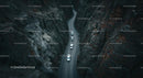 Cars Navigating a Curvy Road Through Majestic Canyon