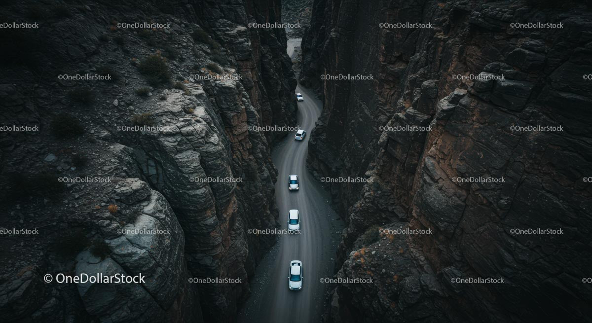Cars Navigating a Narrow Mountain Pass