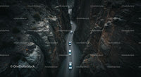 Cars Navigating a Narrow Mountain Pass
