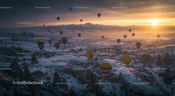 Majestic Hot Air Balloons Over Snowy Cappadocia at Sunrise