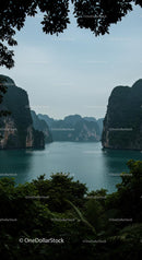 Majestic Cliffs and Tranquil Waters Surrounded by Lush Foliage