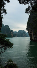 Serene Bay with Majestic Limestone Cliffs and Lush Greenery