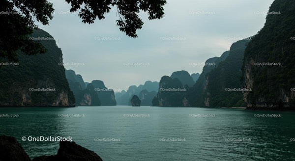 Misty Limestone Cliffs and Tranquil Waters