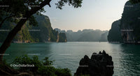 Tranquil Lake Surrounded by Lush Mountains and Cliffs