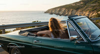 Two Women Driving Vintage Convertible by Ocean