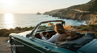 Friends on a Coastal Road Trip in Convertible Car