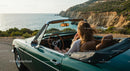 Woman Driving Vintage Convertible on Scenic Coastal Road