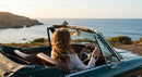 Two Women Driving Vintage Convertible by Ocean