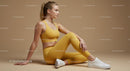 Woman in Yellow Activewear Posing Calmly in Studio
