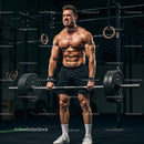 Muscular Athlete Lifting Heavy Barbell in Gym Setting