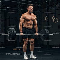 Muscular Man Lifting Heavy Barbell in Gym