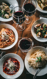 Italian Cuisine with Pasta and Wine on Wooden Table