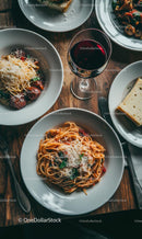 Spaghetti and Wine on a Rustic Wooden Table
