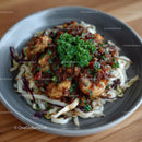 Gourmet Shrimp Dish with Savory Sauce and Fresh Parsley